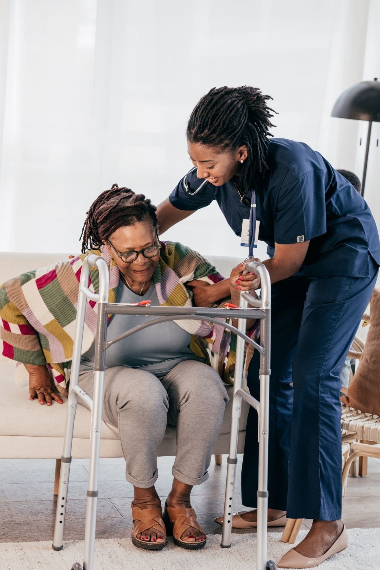 A Crescent Care worker helping an older woman stay safe and independent at home